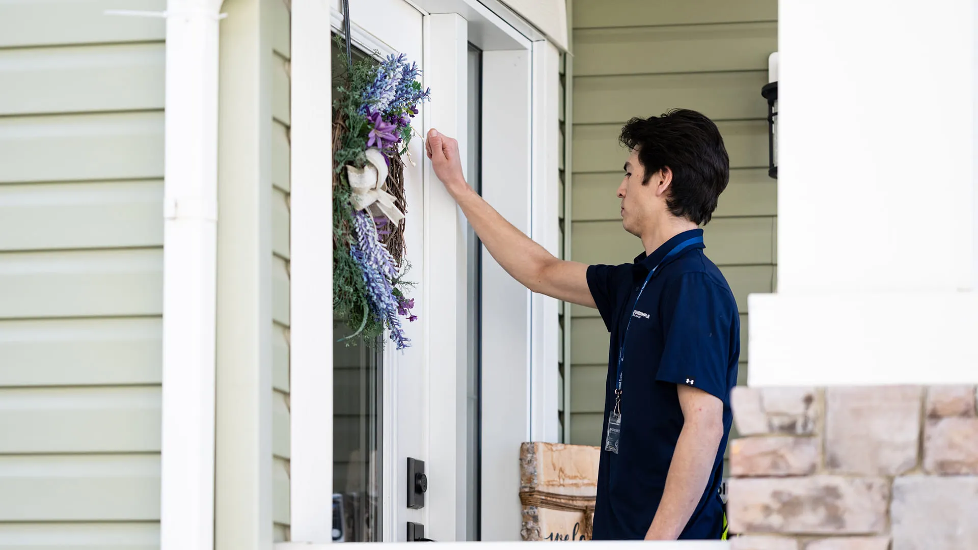 Technician-Knocking-On-Residential-Front-Door